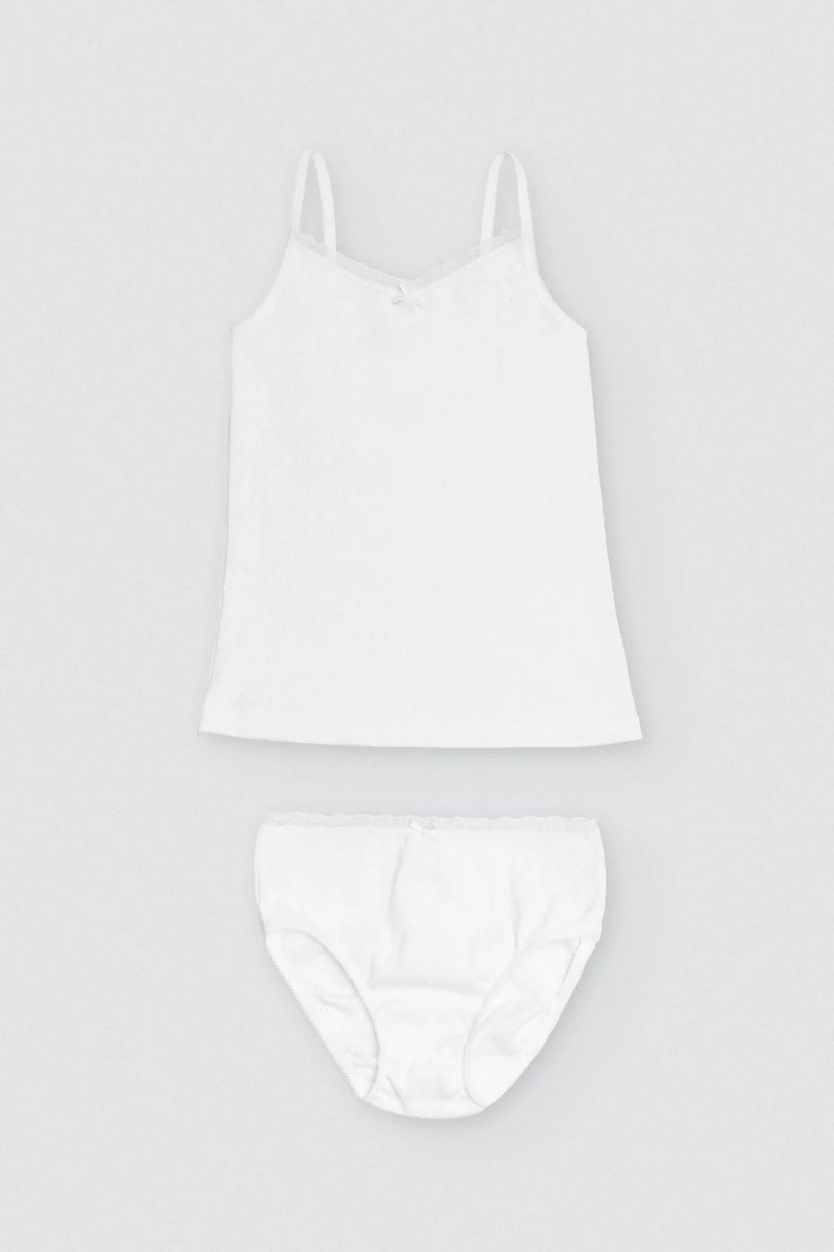 Completo maglietta bianca traforata e slip da bambina